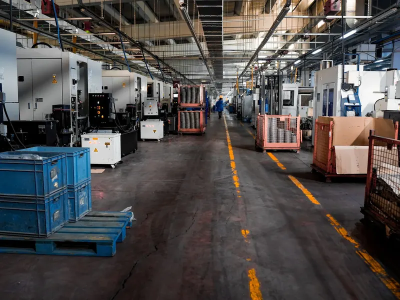 A factory floor with machinery and crates